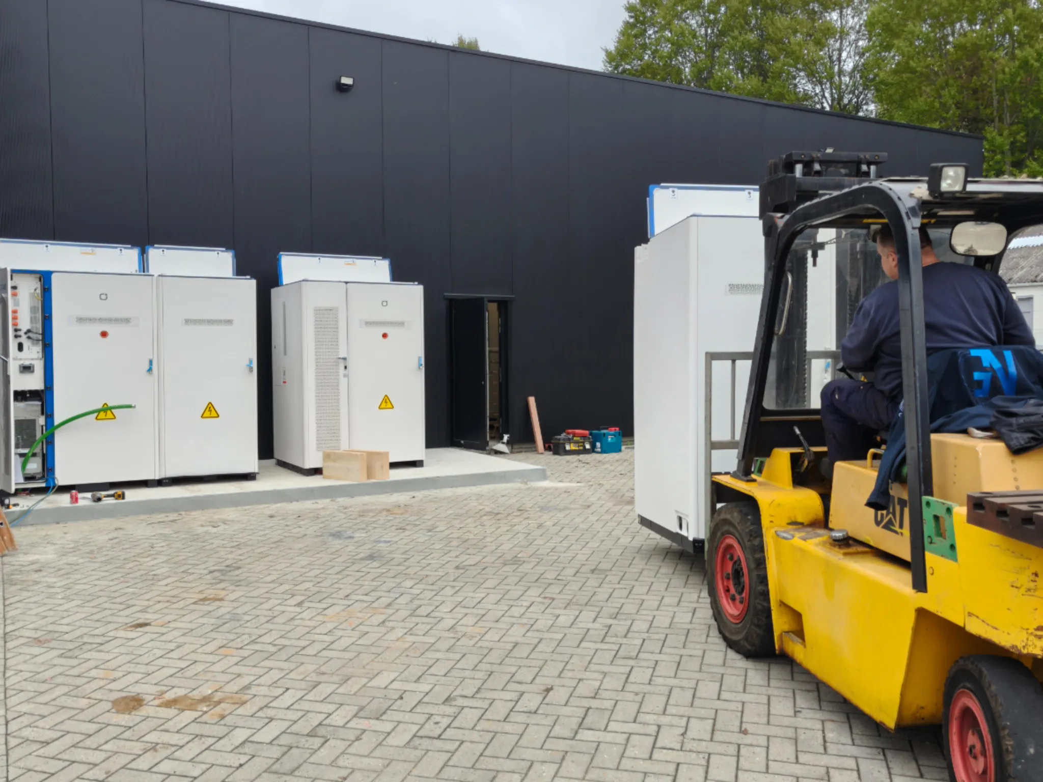 Delivery of battery containers with forklift